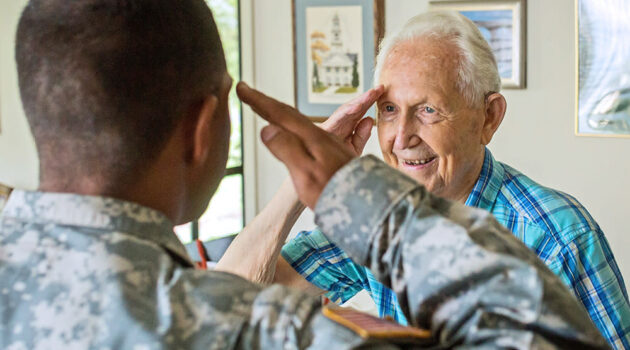 A senior saluting another military member.