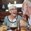 Senior couple eating dinner in restaurant