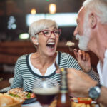 Senior couple eating dinner in restaurant