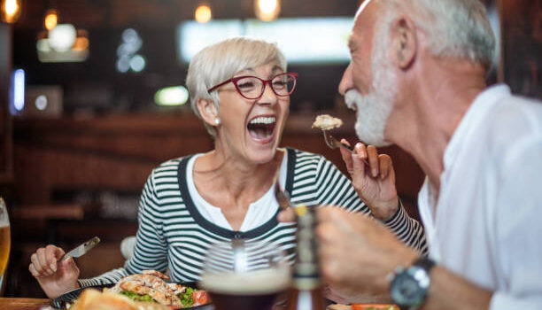 Senior couple eating dinner in restaurant