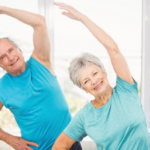 A female and male senior doing a mobility exercise.