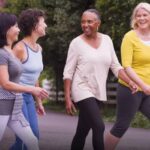 A group of female seniors walking outside.