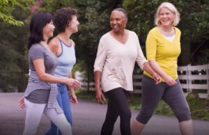 A group of female seniors walking outside.