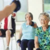 Seniors exercising in a group class setting.
