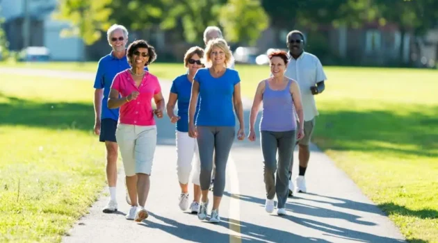 A group of seniors walking in the park.